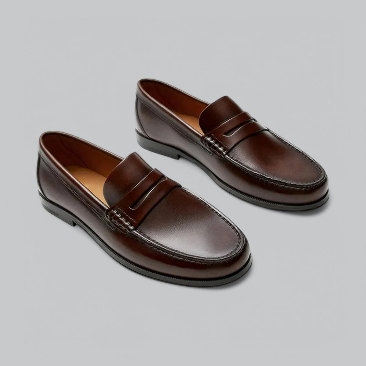 Men's plain penny loafers with stitched trim and low heel