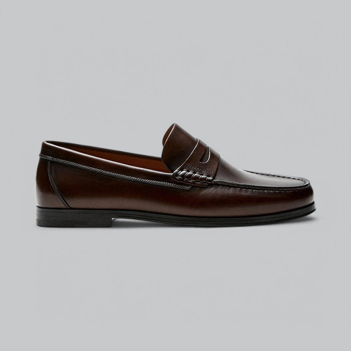 Men's plain penny loafers with stitched trim and low heel