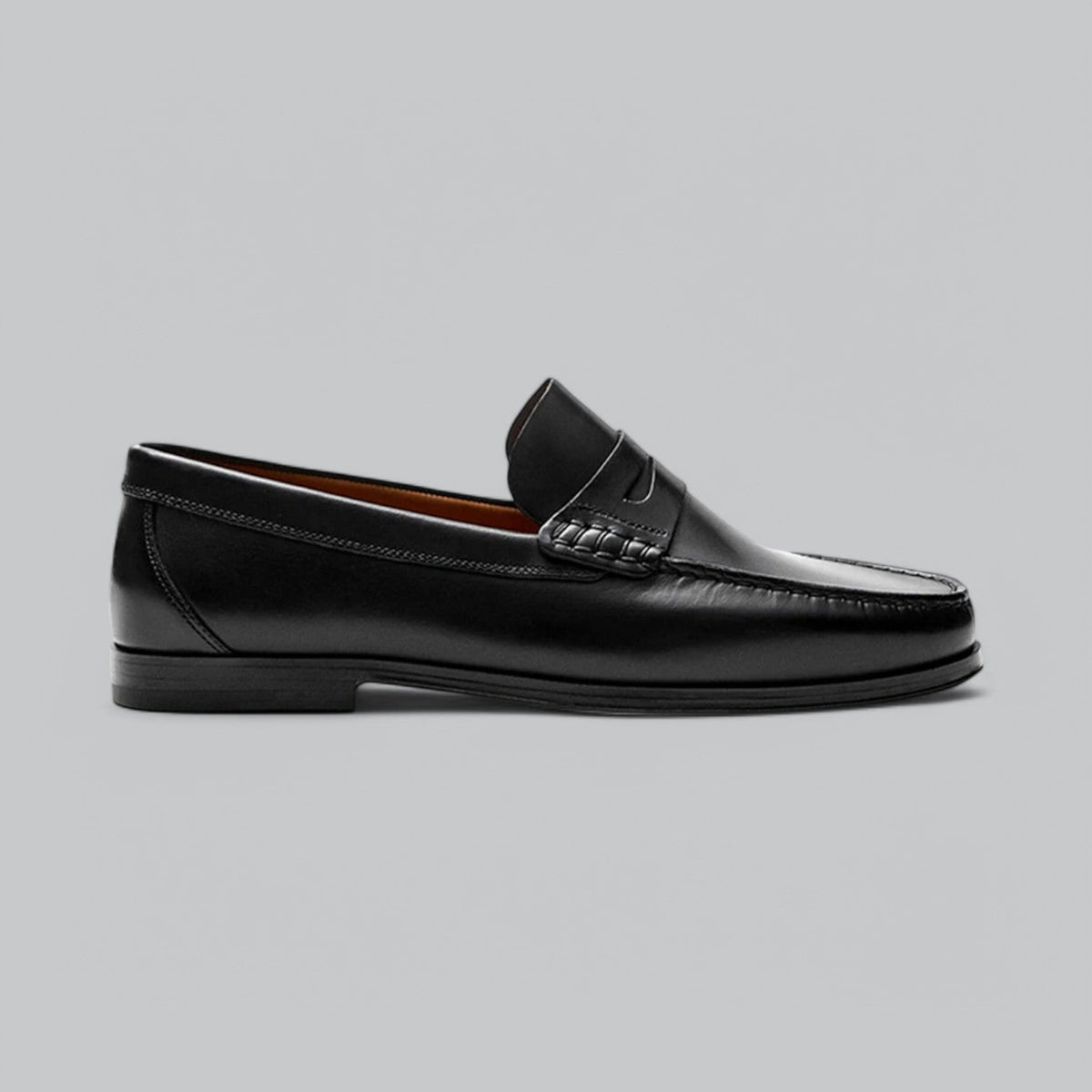 Men's plain penny loafers with stitched trim and low heel