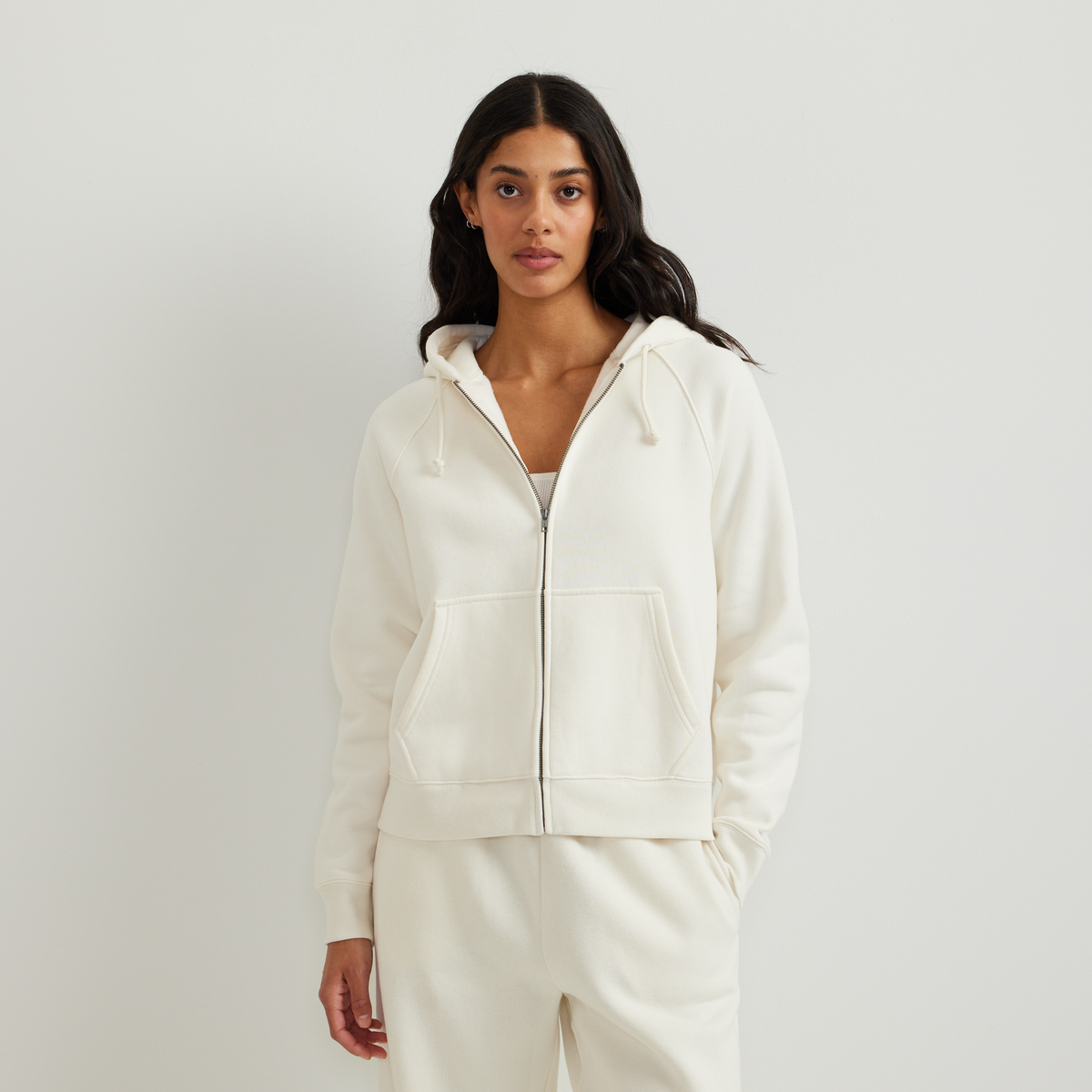 Women's full-zip hooded sweatshirt with long sleeves and front pouch pockets