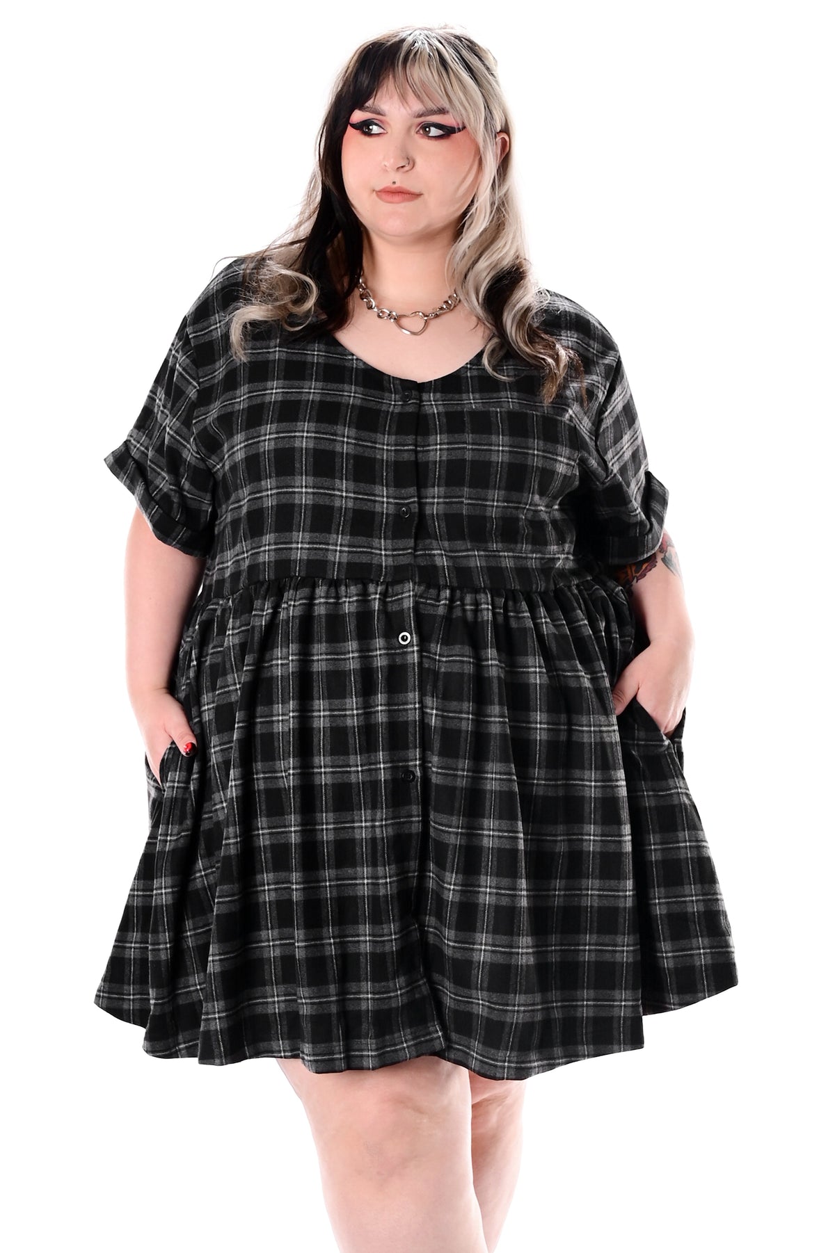 Women's black and grey checked babydoll mini dress with short sleeves and side pockets