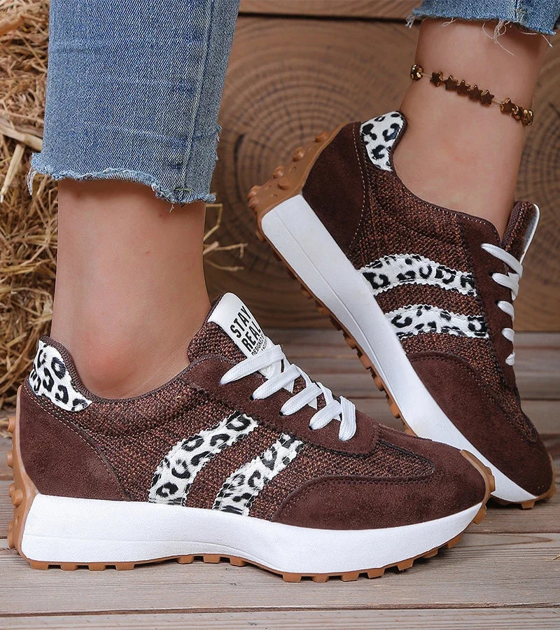 Women's striped lace-up trainers with a round toe and textured flat sole