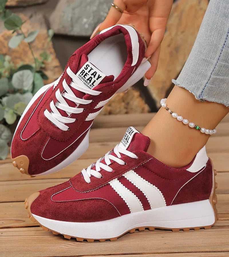 Women's striped lace-up trainers with a round toe and textured flat sole