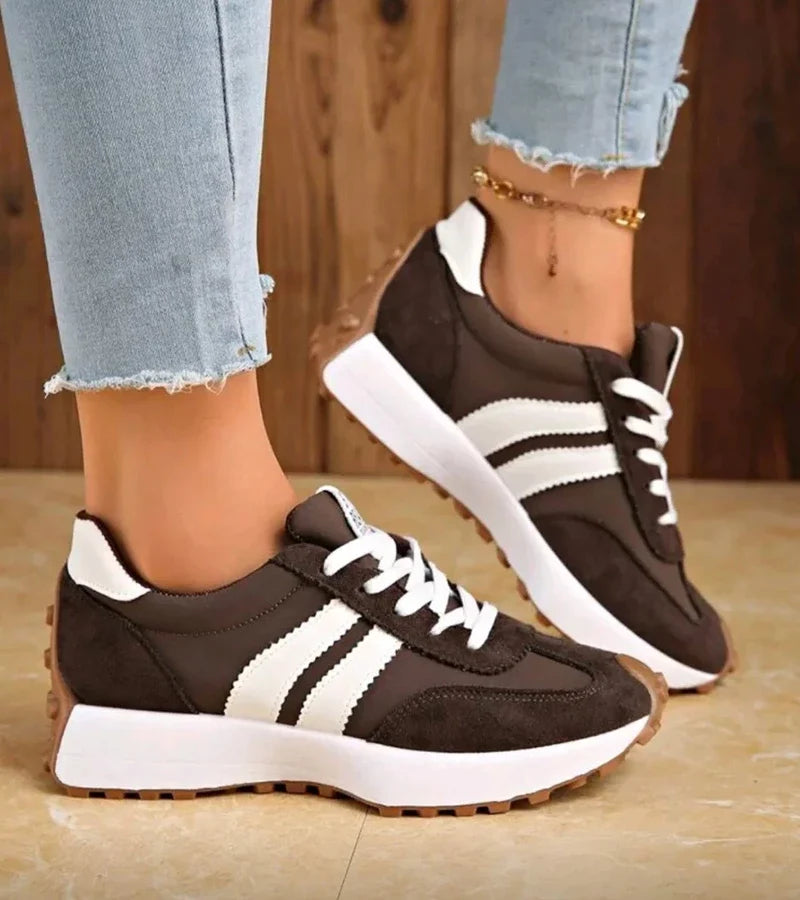 Women's striped lace-up trainers with a round toe and textured flat sole