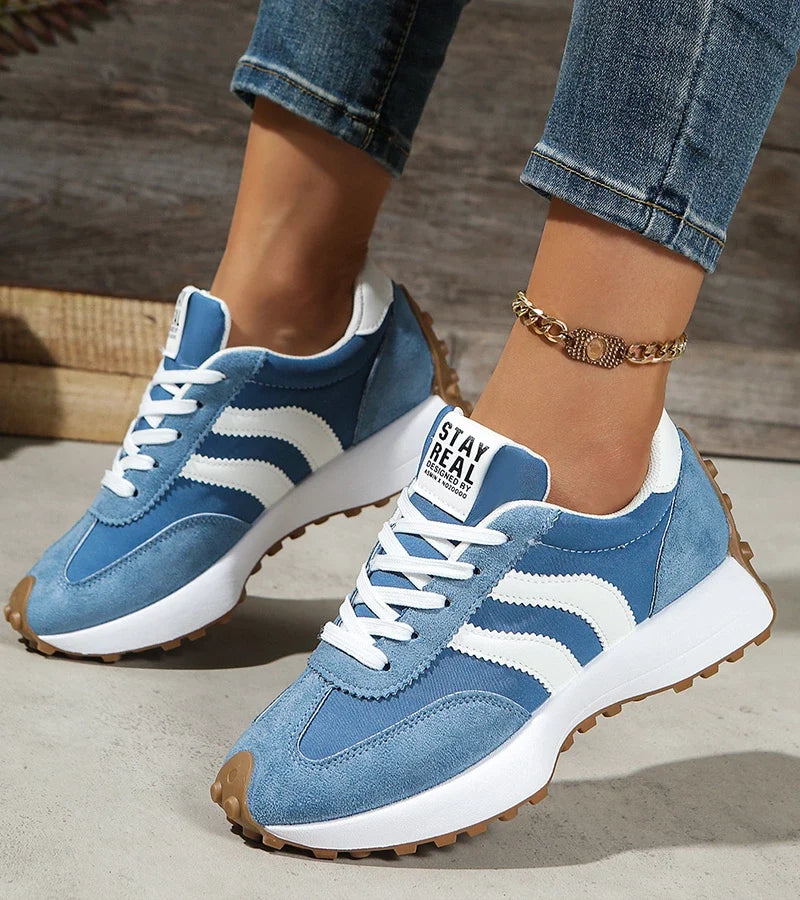Women's striped lace-up trainers with a round toe and textured flat sole