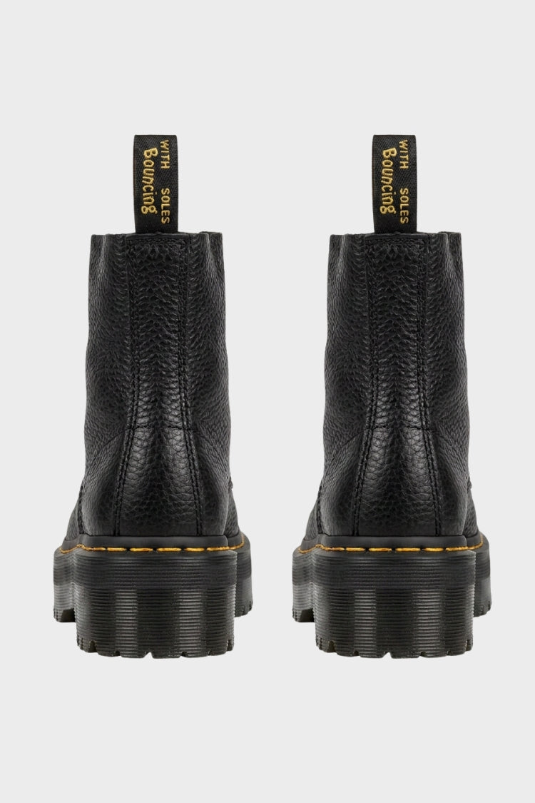 Black women's platform ankle boots with front zip, lace detail and lug soles
