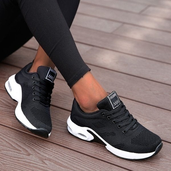 Women's lace-up sneakers with textured panels and contrasting layered soles