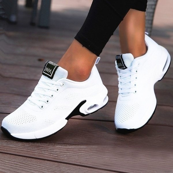 Women's lace-up sneakers with textured panels and contrasting layered soles