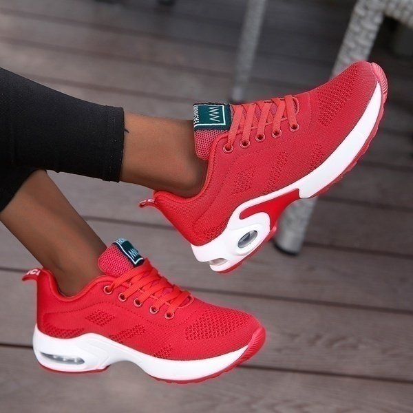 Women's lace-up sneakers with textured panels and contrasting layered soles