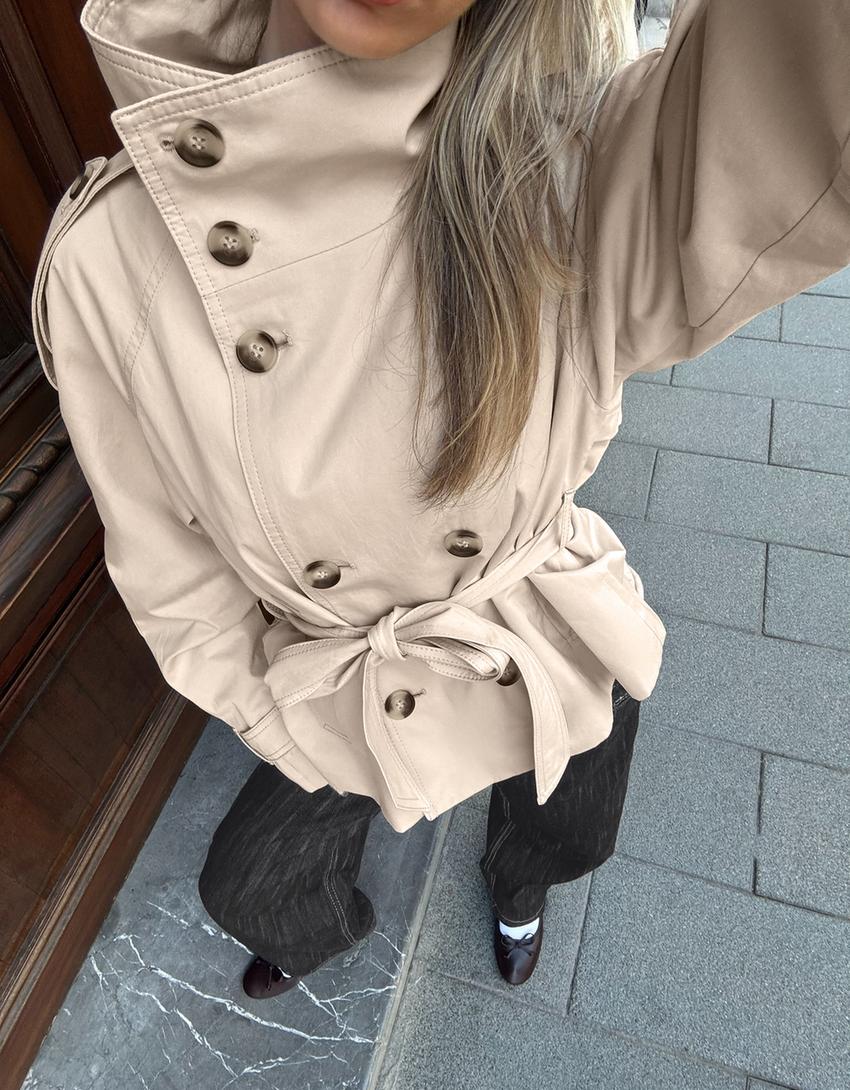 Women's short belted trench coat with high collar and long sleeves