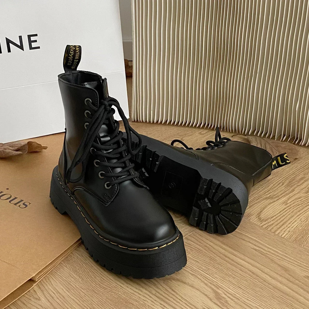 Women's black lace-up combat ankle boots with platform soles
