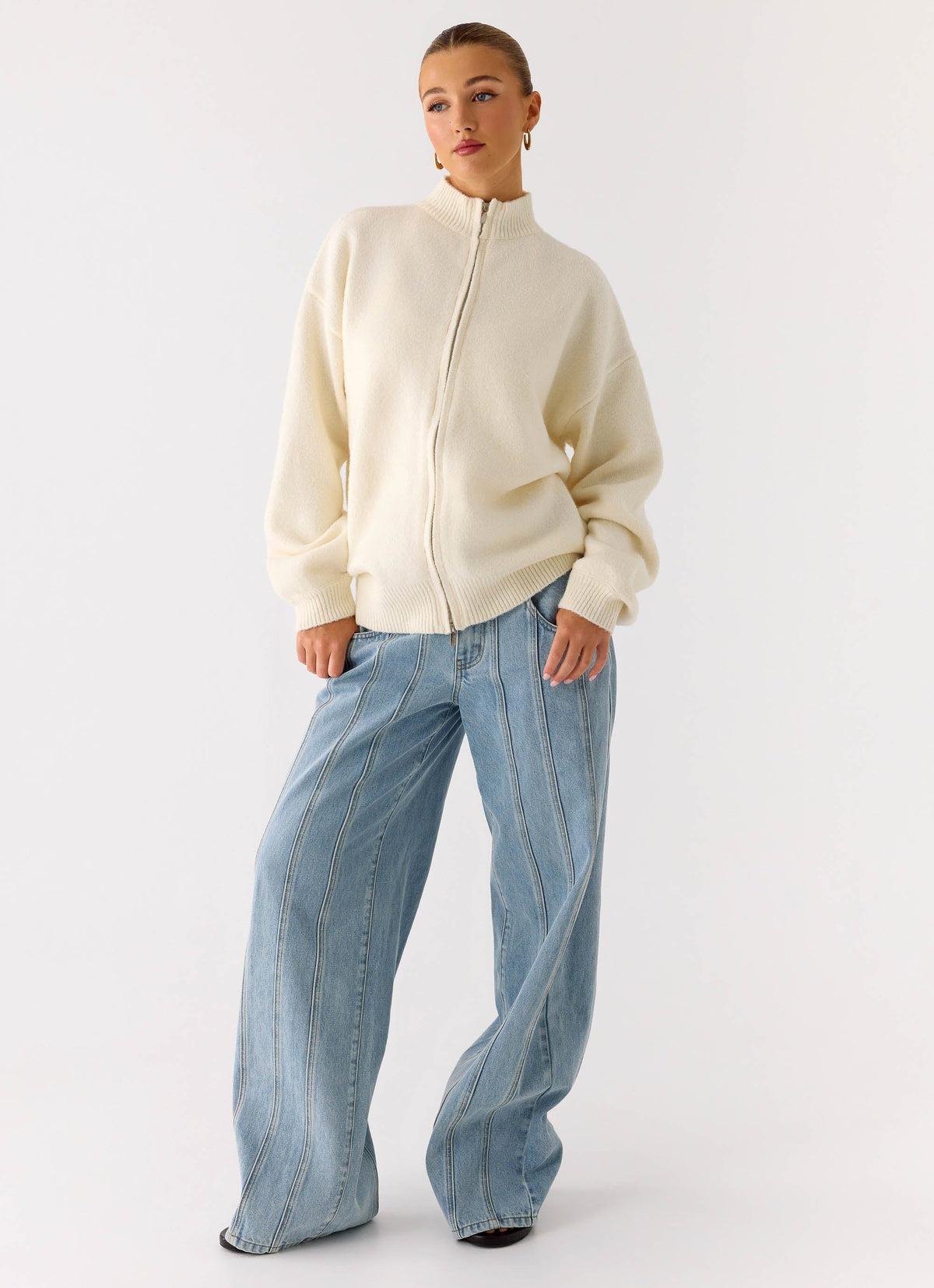 Women's ivory knitted zip jacket with high neck and long sleeves