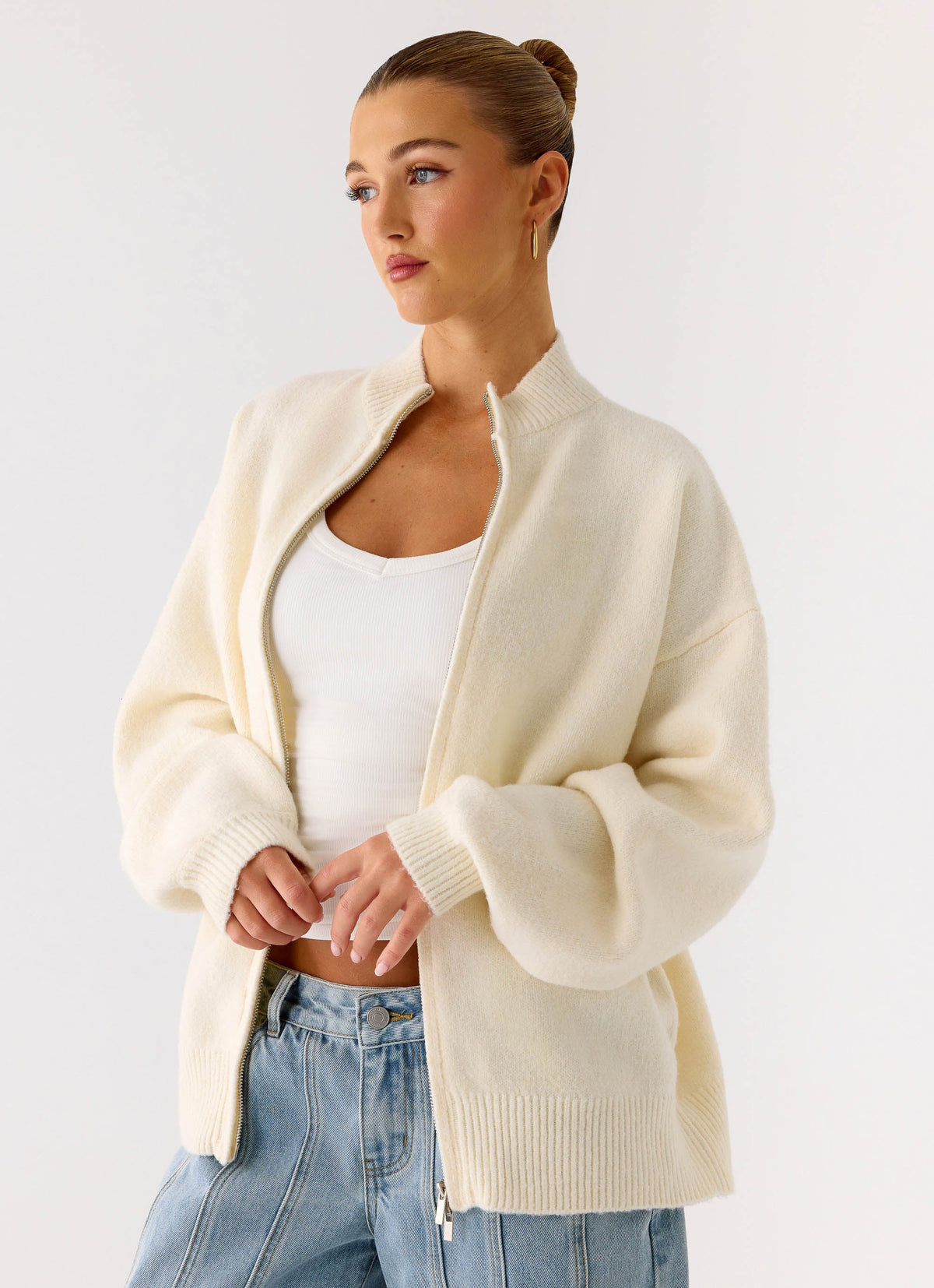 Women's ivory knitted zip jacket with high neck and long sleeves