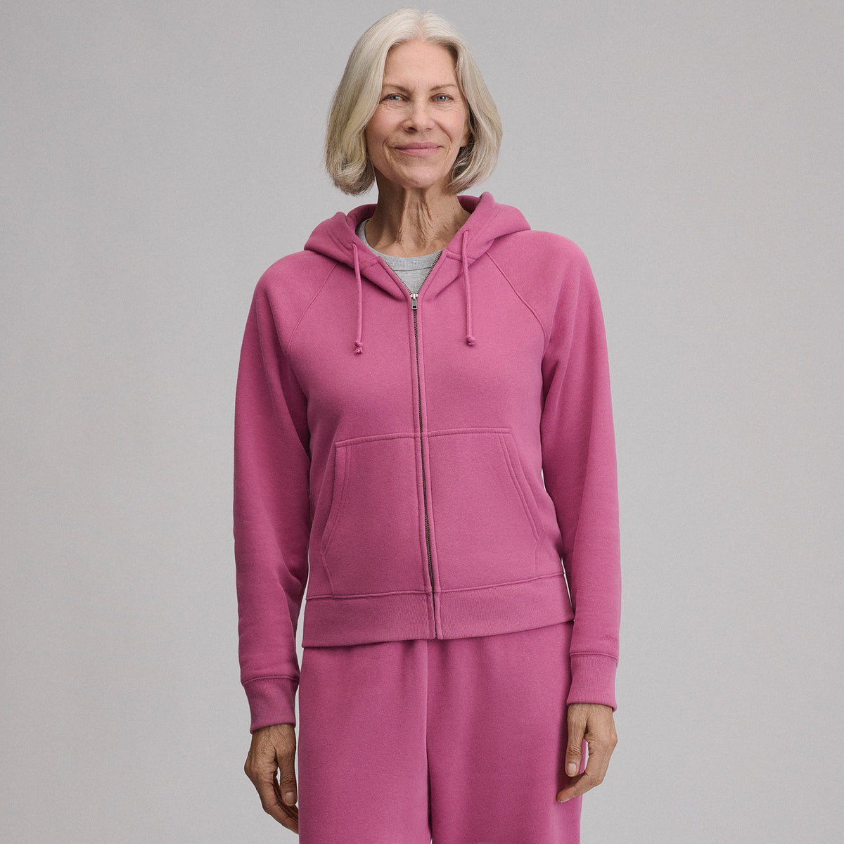 Women's full-zip hooded sweatshirt with long sleeves and front pouch pockets