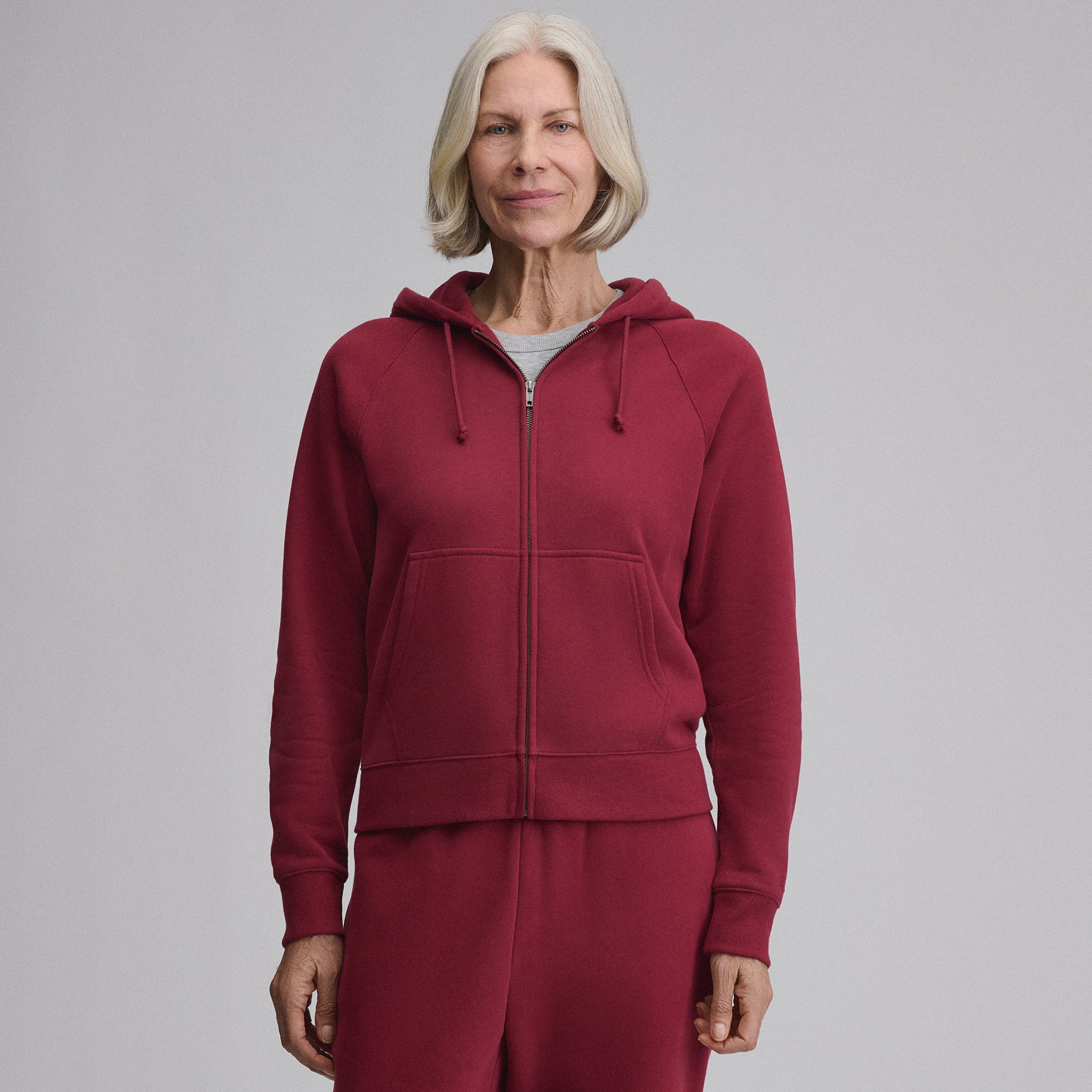 Women's full-zip hooded sweatshirt with long sleeves and front pouch pockets