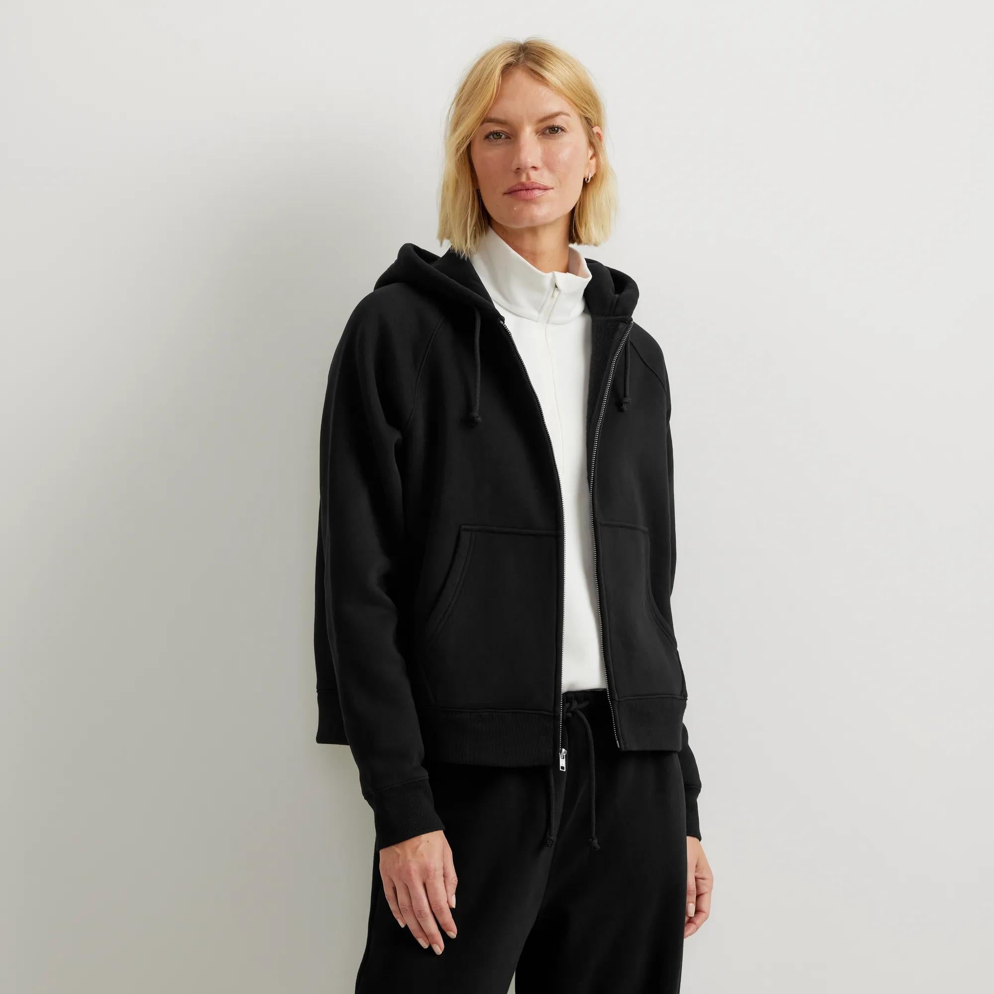 Women's full-zip hooded sweatshirt with long sleeves and front pouch pockets