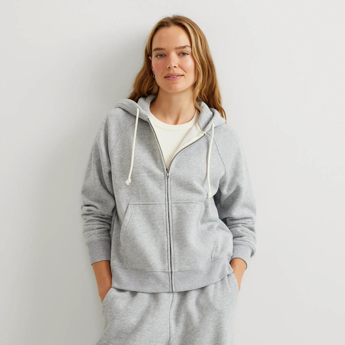Women's full-zip hooded sweatshirt with long sleeves and front pouch pockets