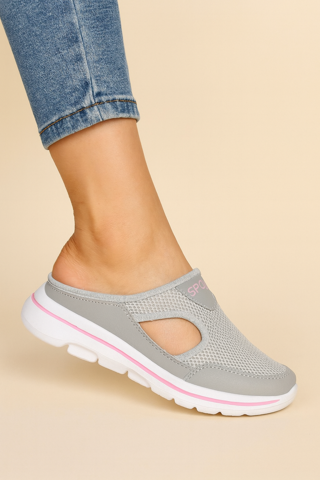 Women's slip-on athletic shoe with mesh panels and layered sole