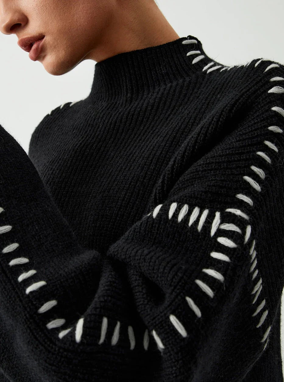 Women's ribbed knit sweater with contrasting stitch trim and long sleeves