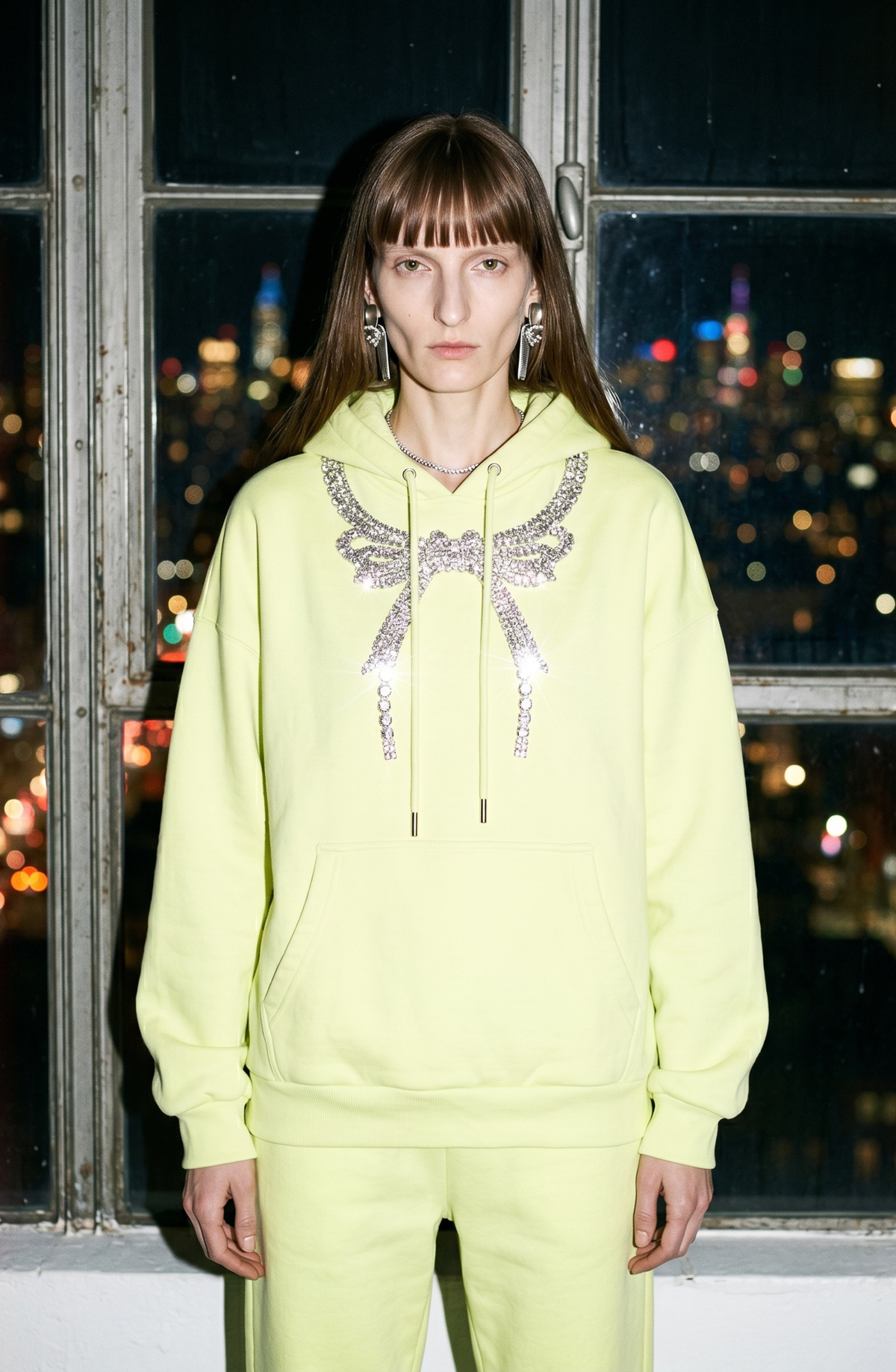 Women's dark hooded hoodie with embellished wing and bow motif, long sleeves and kangaroo pocket