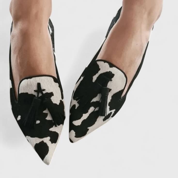 Women's pointed animal print loafers with tassel detailing