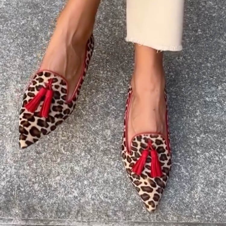 Women's pointed animal print loafers with tassel detailing