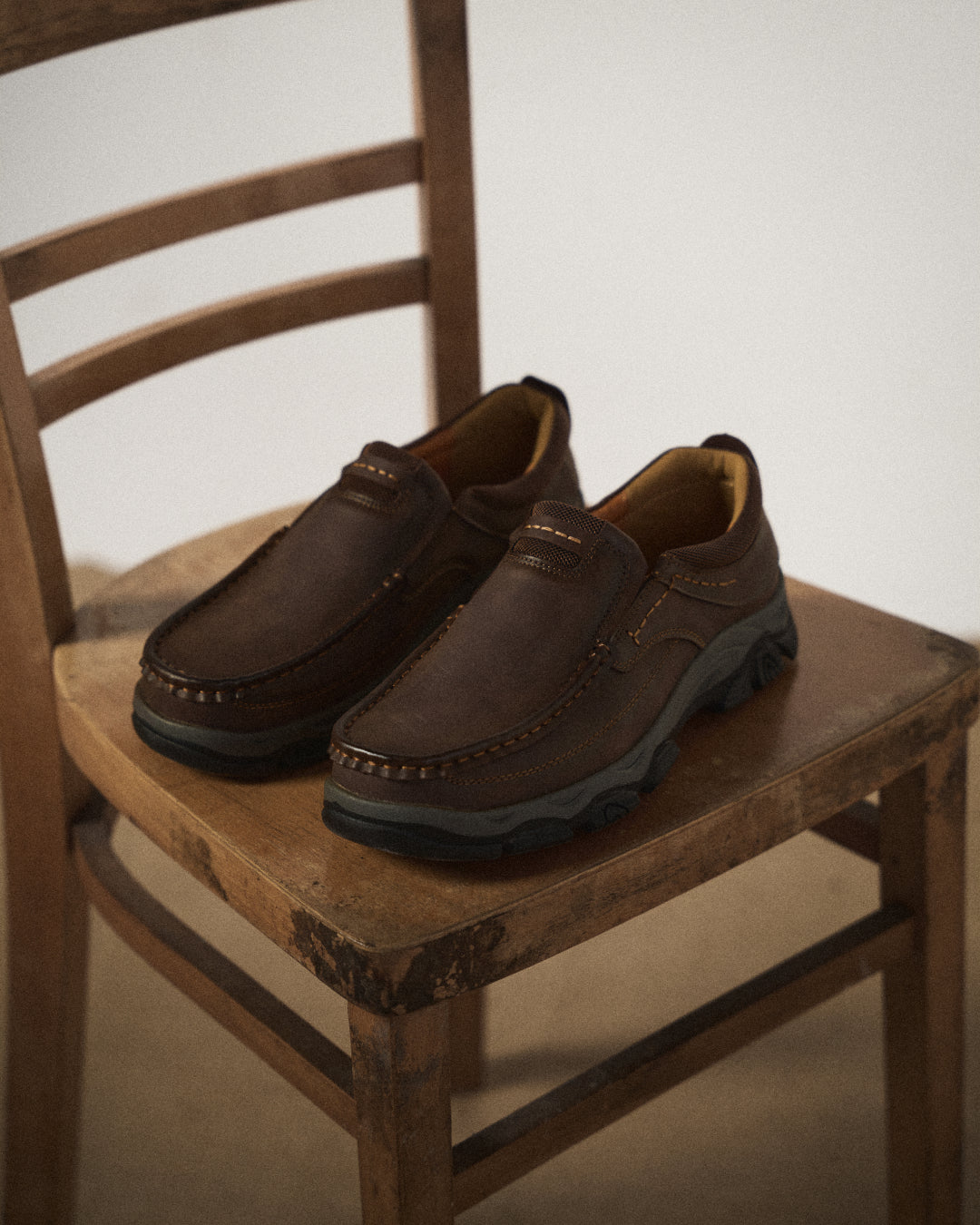 Men's slip-on loafers with moc toe stitching and textured lug soles