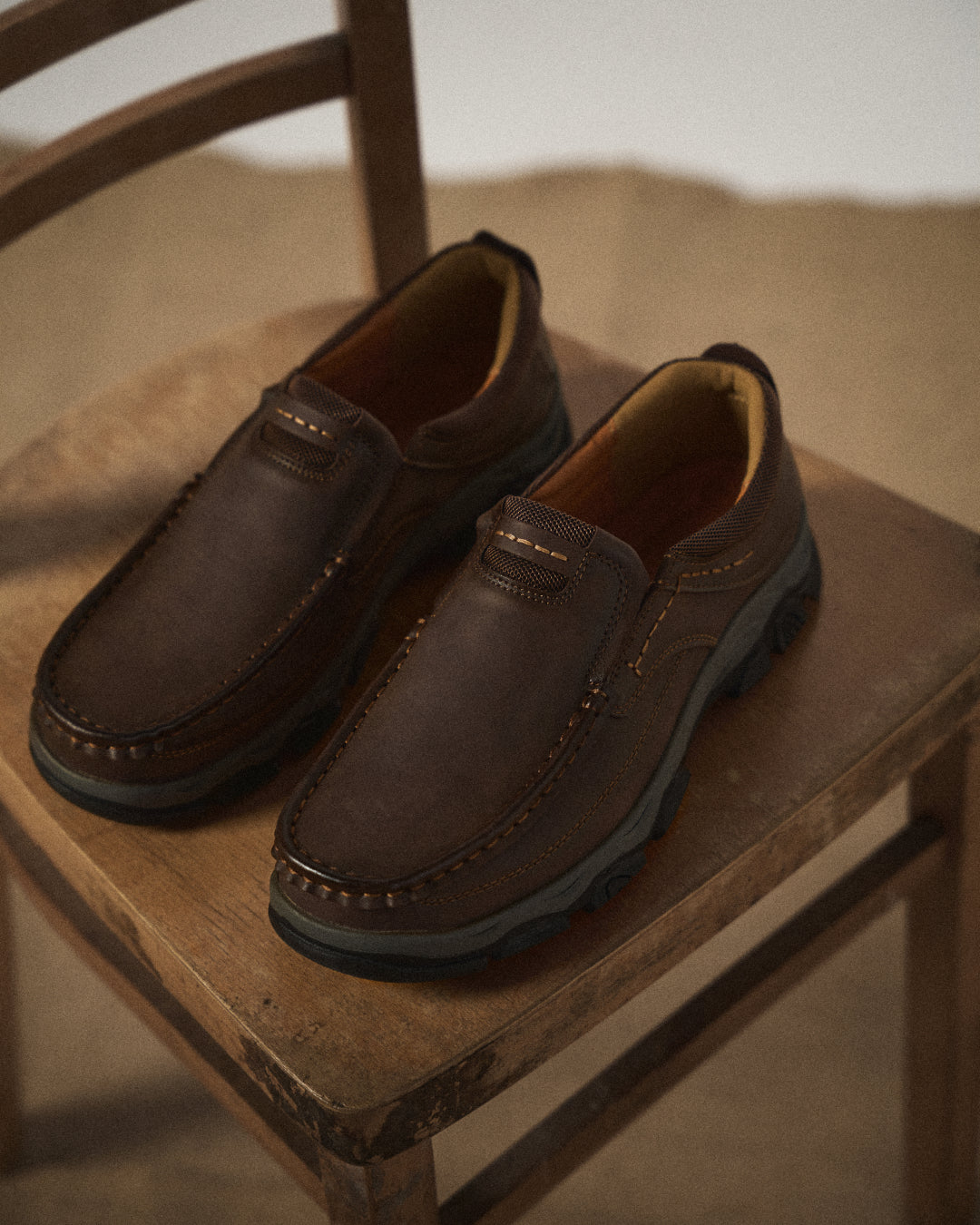 Men's slip-on loafers with moc toe stitching and textured lug soles