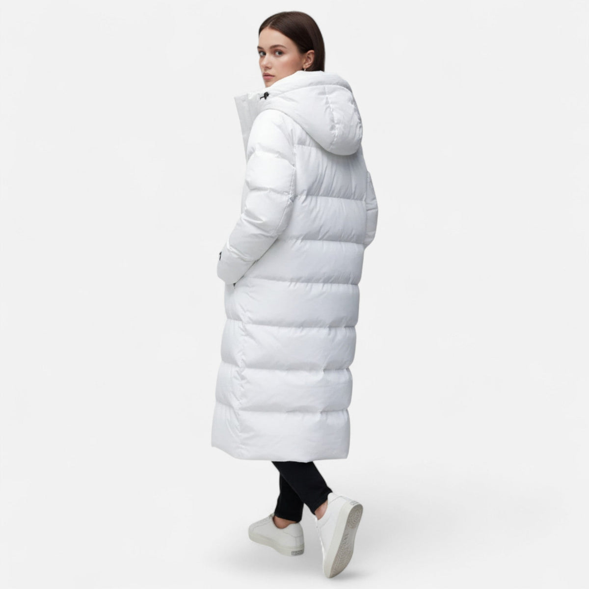 Women's long quilted hooded puffer coat shown in white and black