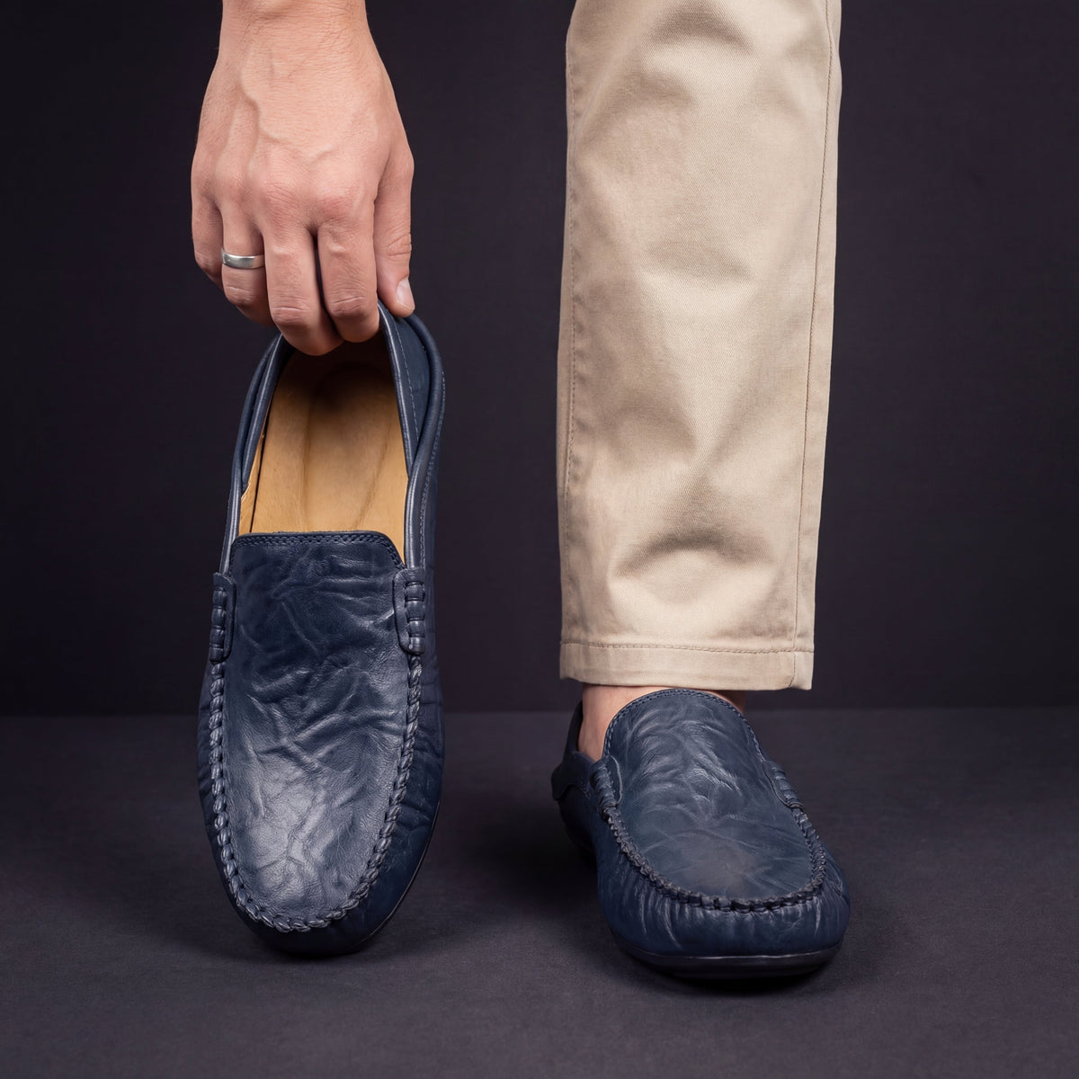 Men's moc toe slip-on loafers with stitched trim and flat soles