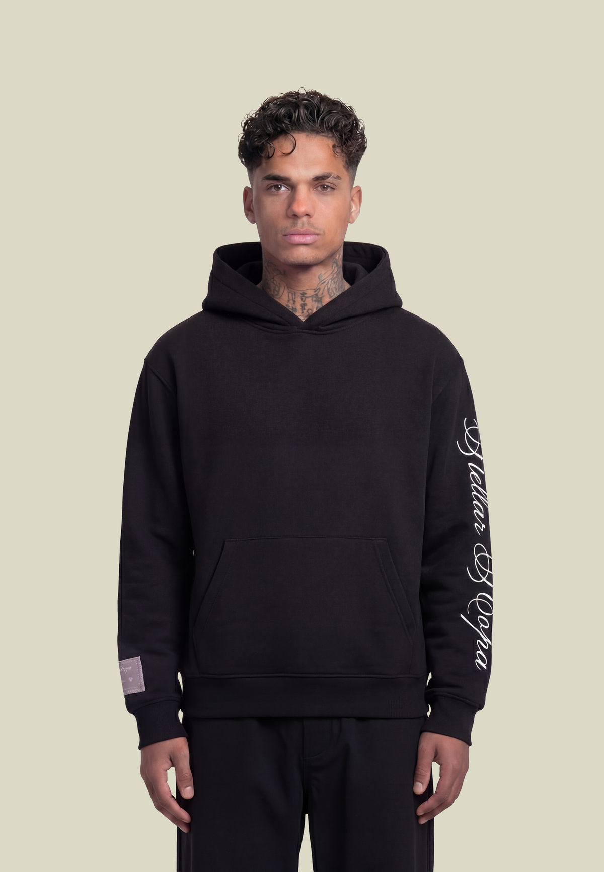 Black hooded sweatshirt with white script sleeve detailing and kangaroo pocket