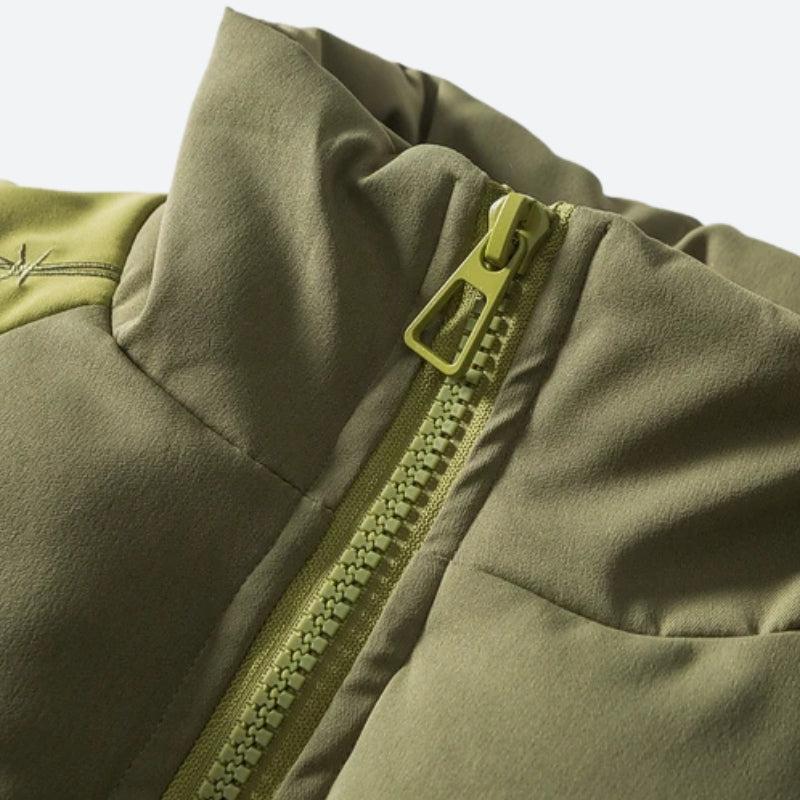 Green padded puffer jacket with textured sleeves and high collar