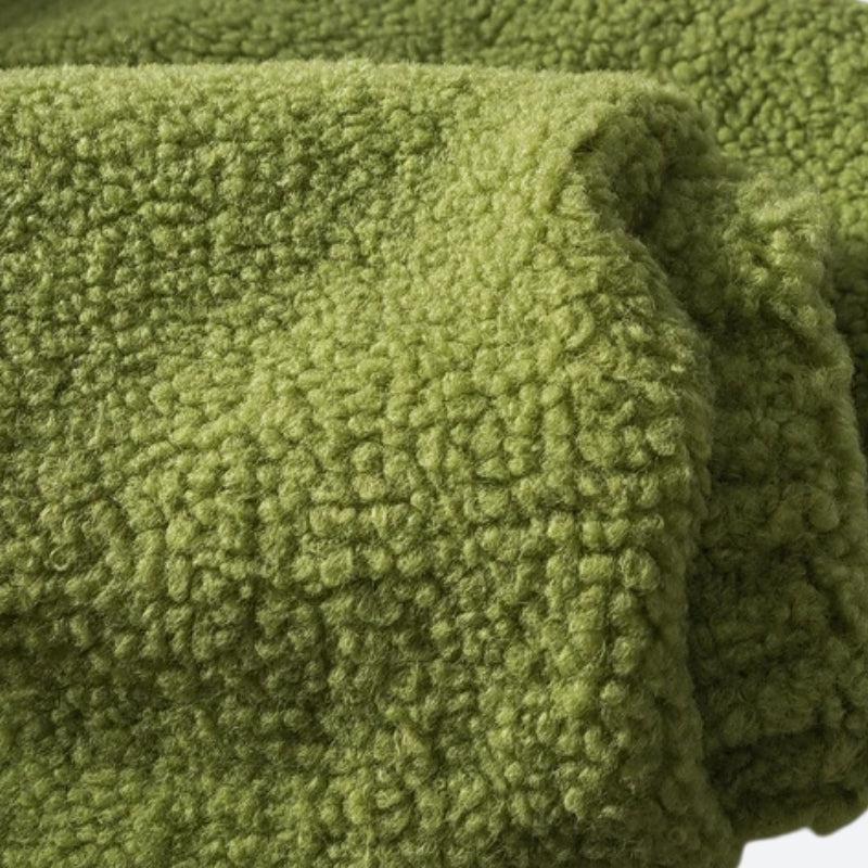 Green padded puffer jacket with textured sleeves and high collar