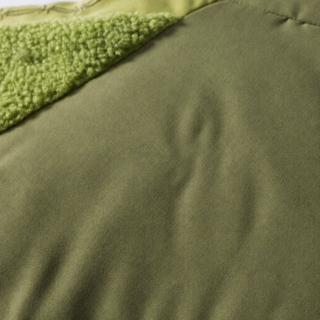 Green padded puffer jacket with textured sleeves and high collar