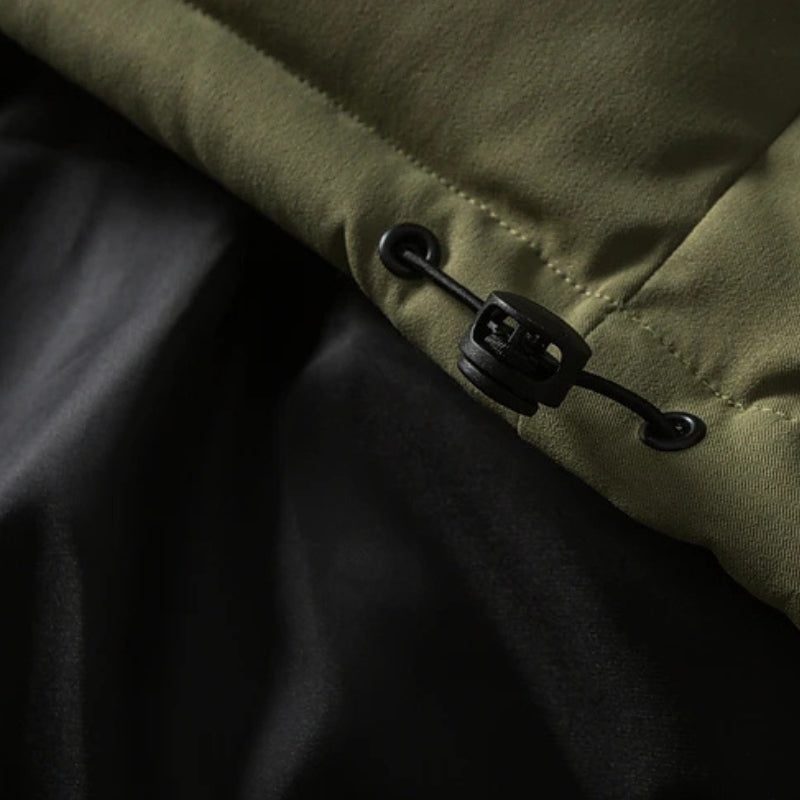 Green padded puffer jacket with textured sleeves and high collar