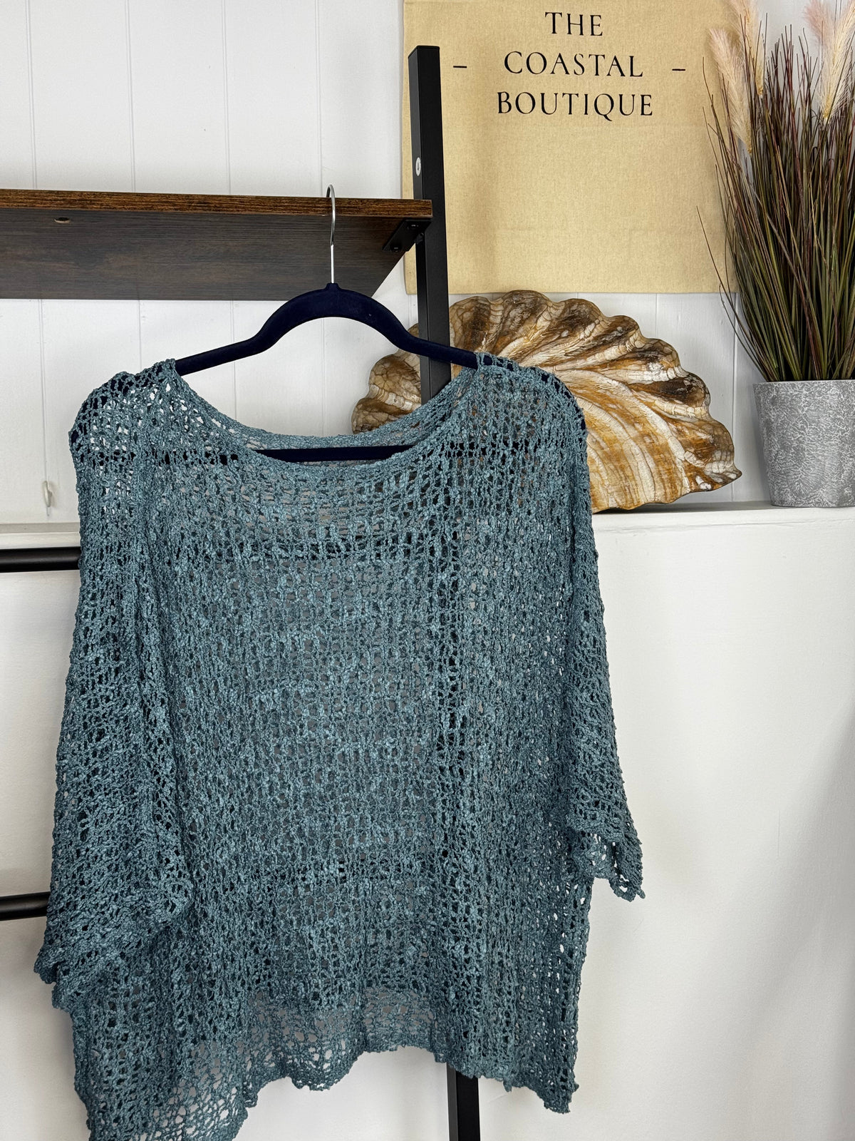 Women's open-knit textured poncho with round neckline and loose batwing sleeves