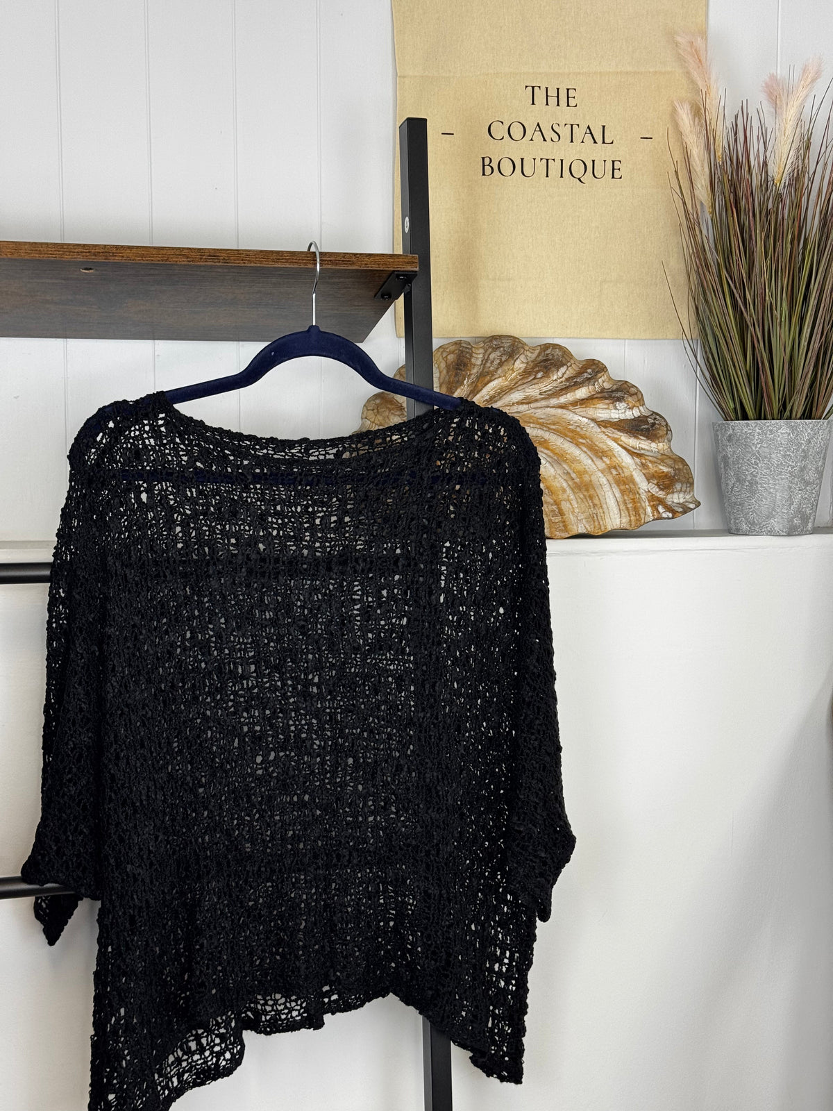 Women's open-knit textured poncho with round neckline and loose batwing sleeves