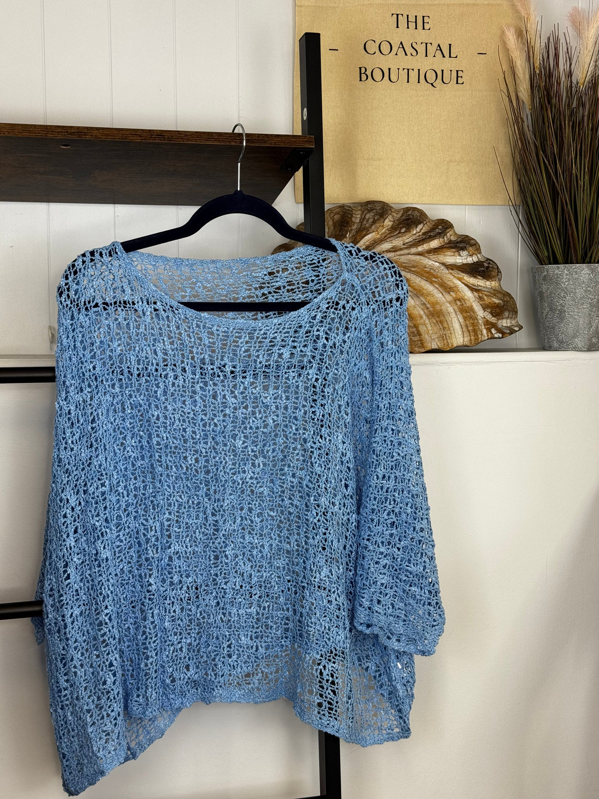 Women's open-knit textured poncho with round neckline and loose batwing sleeves