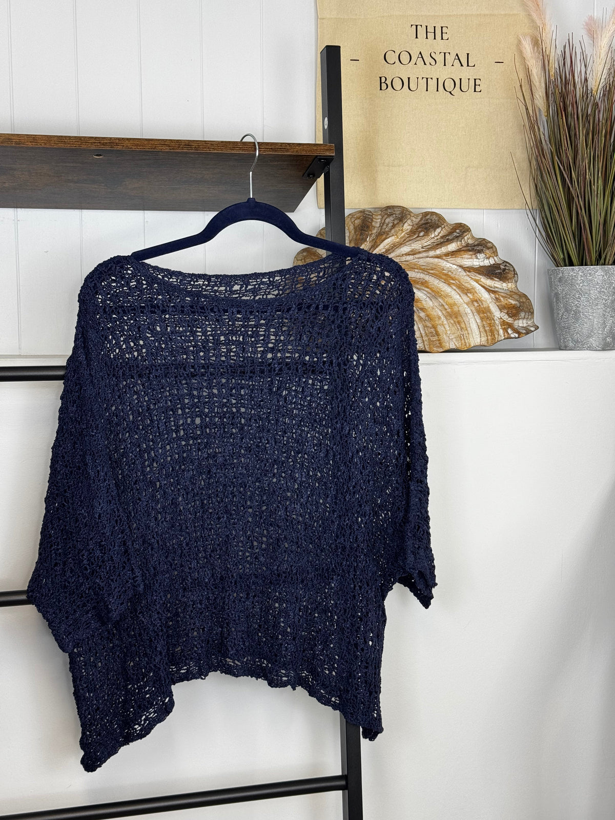 Women's open-knit textured poncho with round neckline and loose batwing sleeves