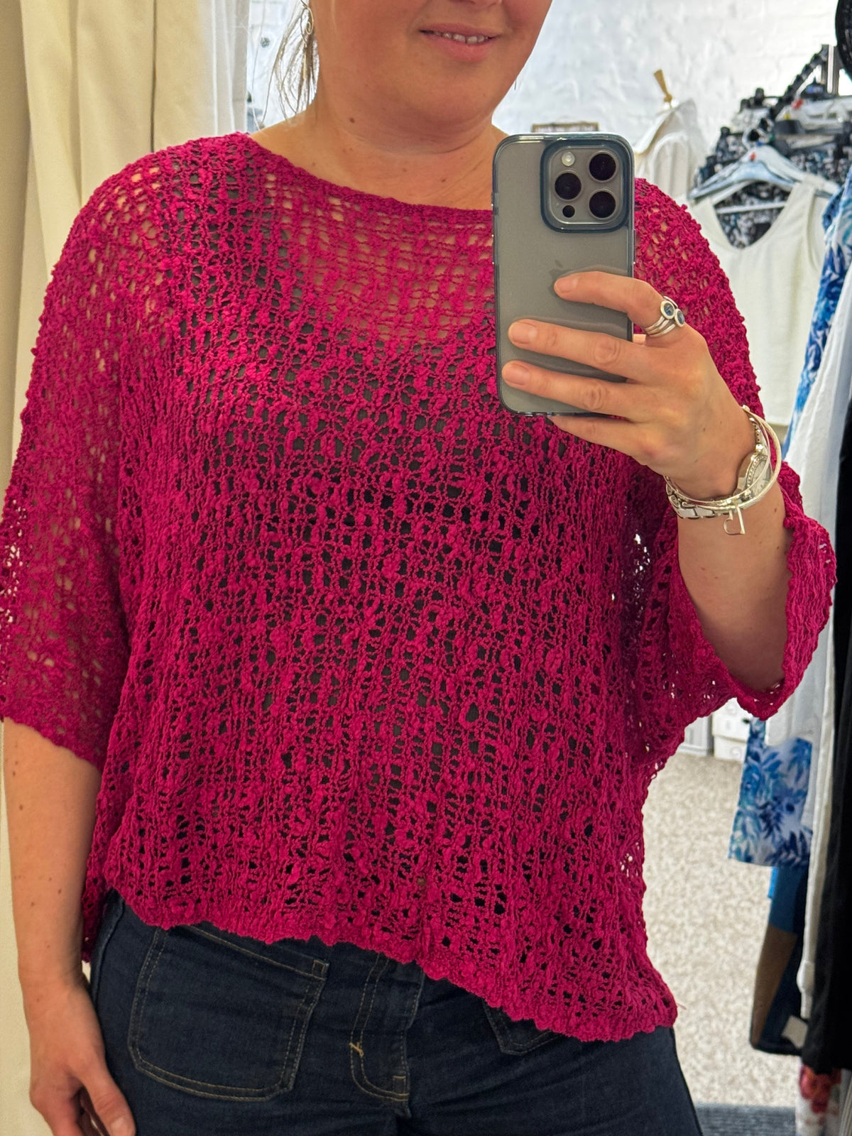 Women's open-knit textured poncho with round neckline and loose batwing sleeves