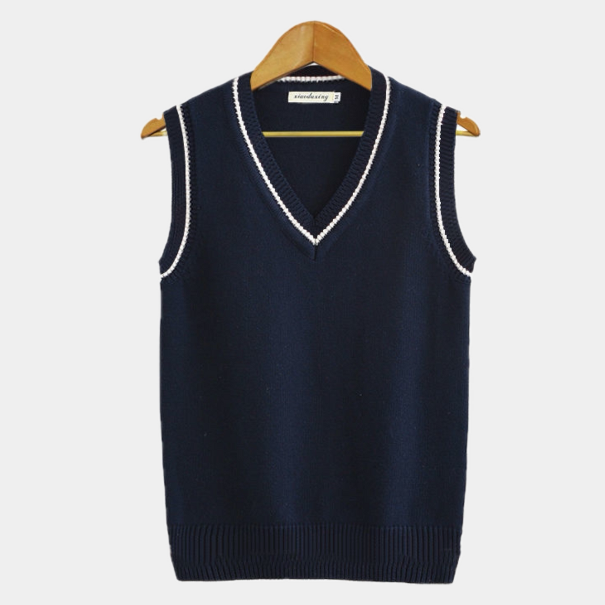 Sleeveless cable knit sweater vest with V-neck and striped trim