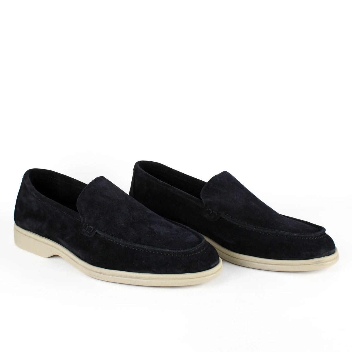Pair of black men's slip-on loafers with contrasting flat soles