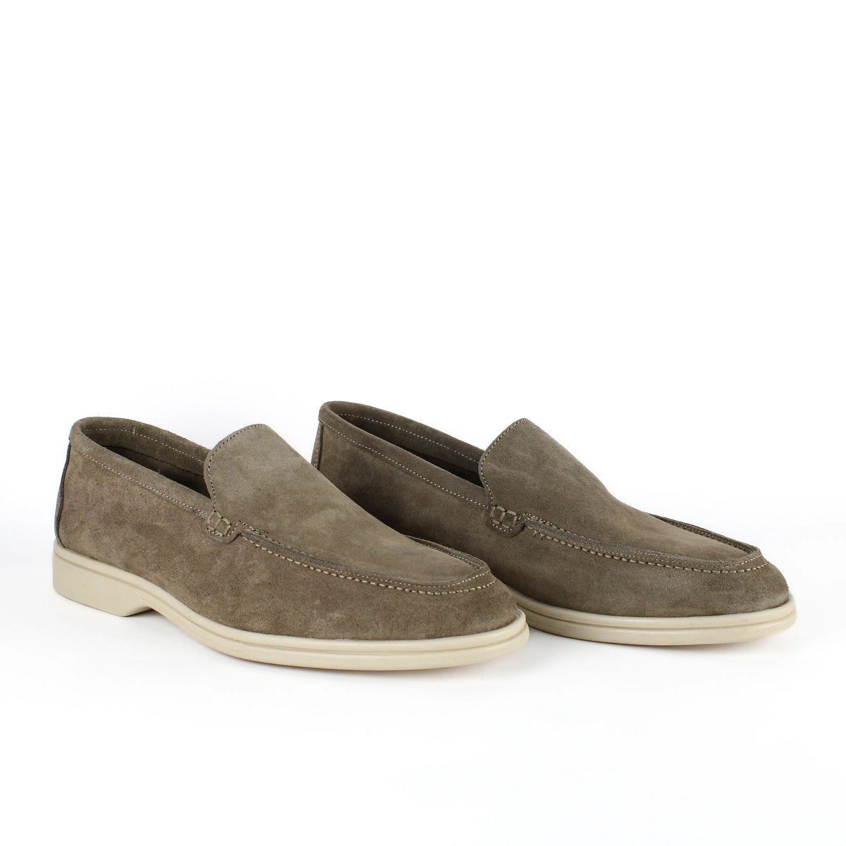 Men's beige slip-on loafers with moc toe stitching and cream soles