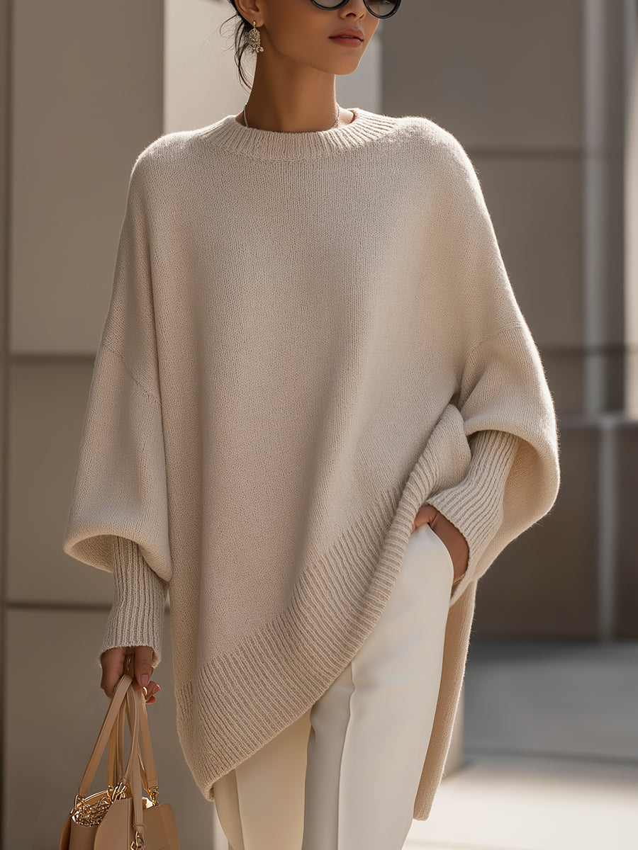 Women's oversized plain crew neck sweater with long sleeves and asymmetric hem