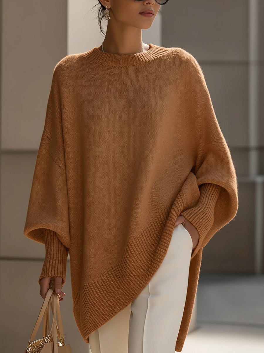 Women's oversized plain crew neck sweater with long sleeves and asymmetric hem