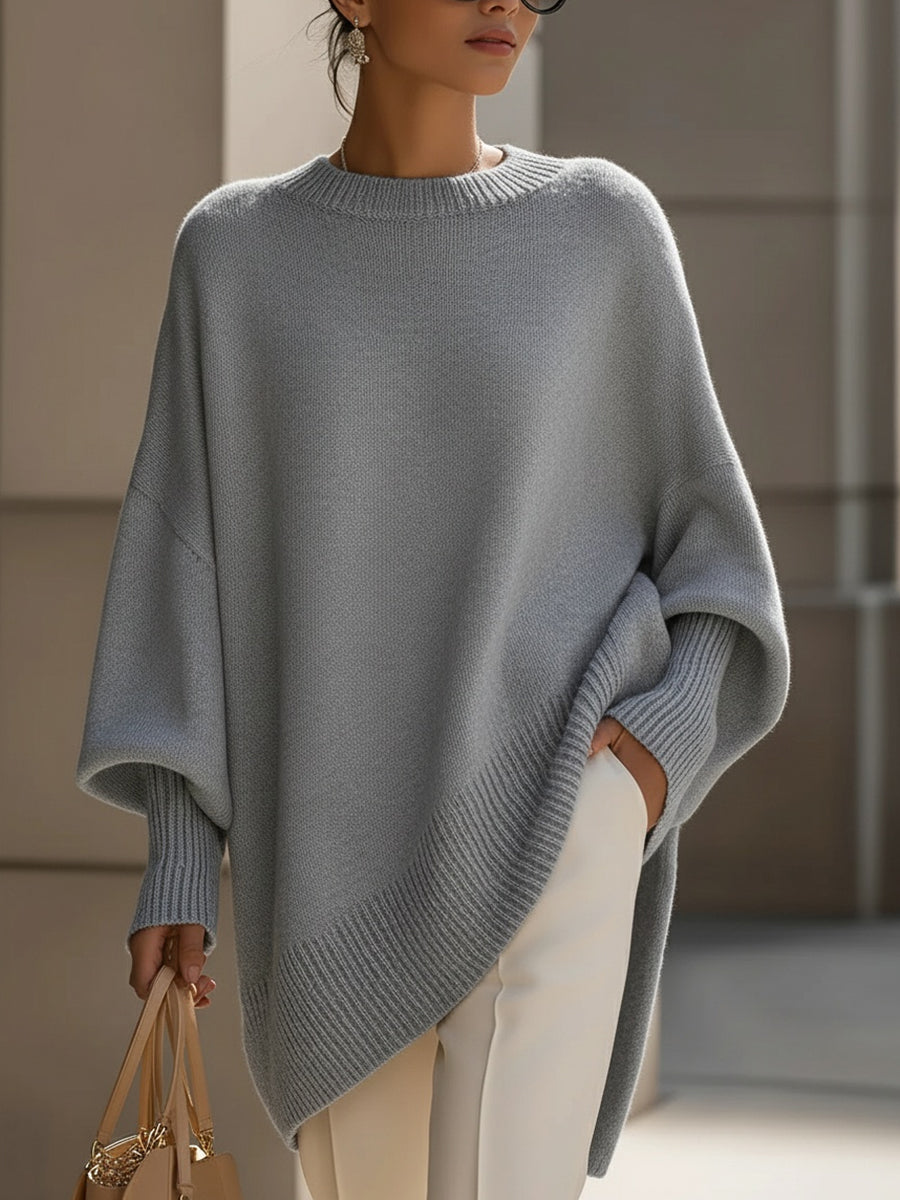 Women's oversized plain crew neck sweater with long sleeves and asymmetric hem