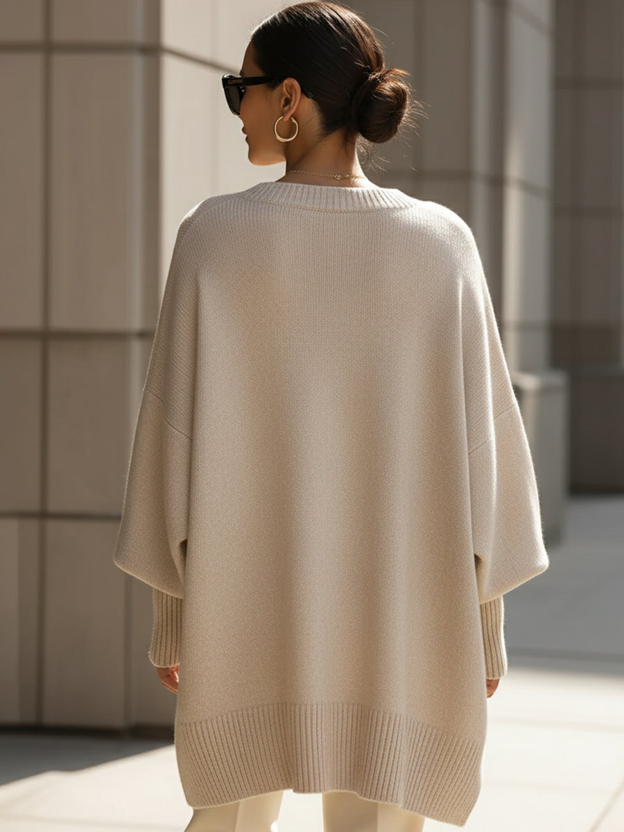 Women's oversized plain crew neck sweater with long sleeves and asymmetric hem