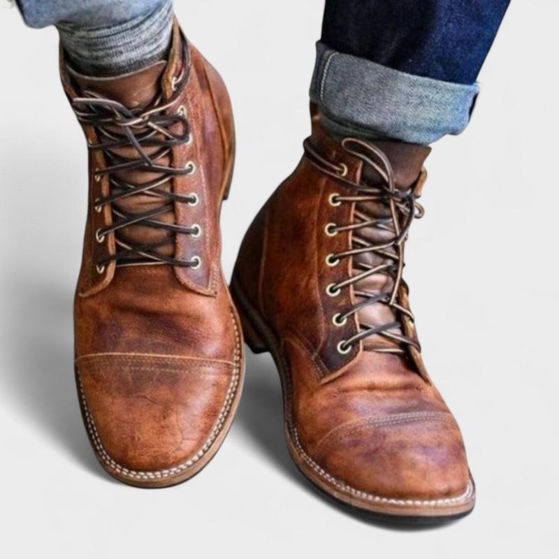 Men's brown lace-up ankle boots with stitched cap-toe detail and low heel