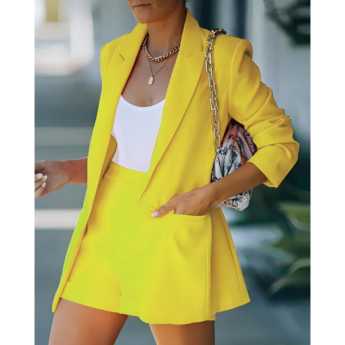 Women's blazer and shorts set with notch lapels and long sleeves