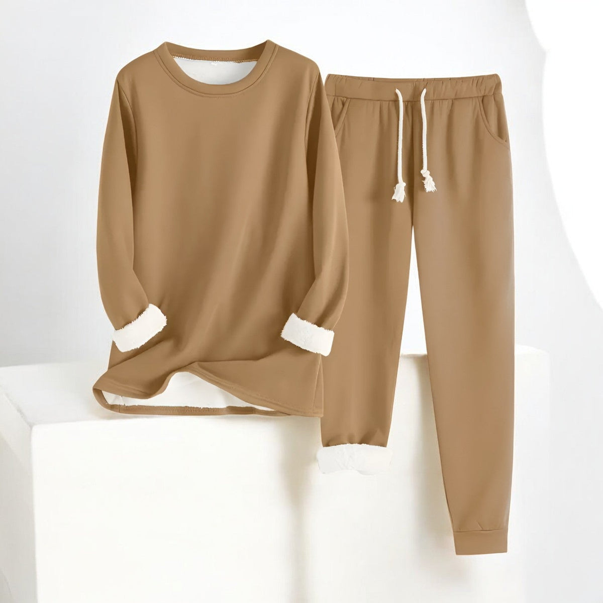 Two-piece crew neck sweatshirt and jogger set with contrasting white cuffs and drawstring trousers